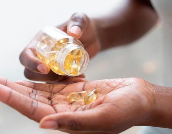 cnne 1234350 woman pouring capsules into her hand